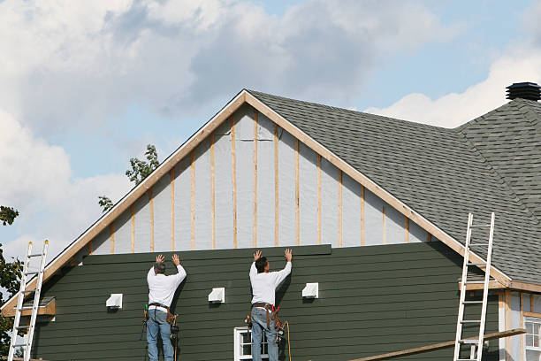 Professional Siding Installation technician working in Junction City, OR